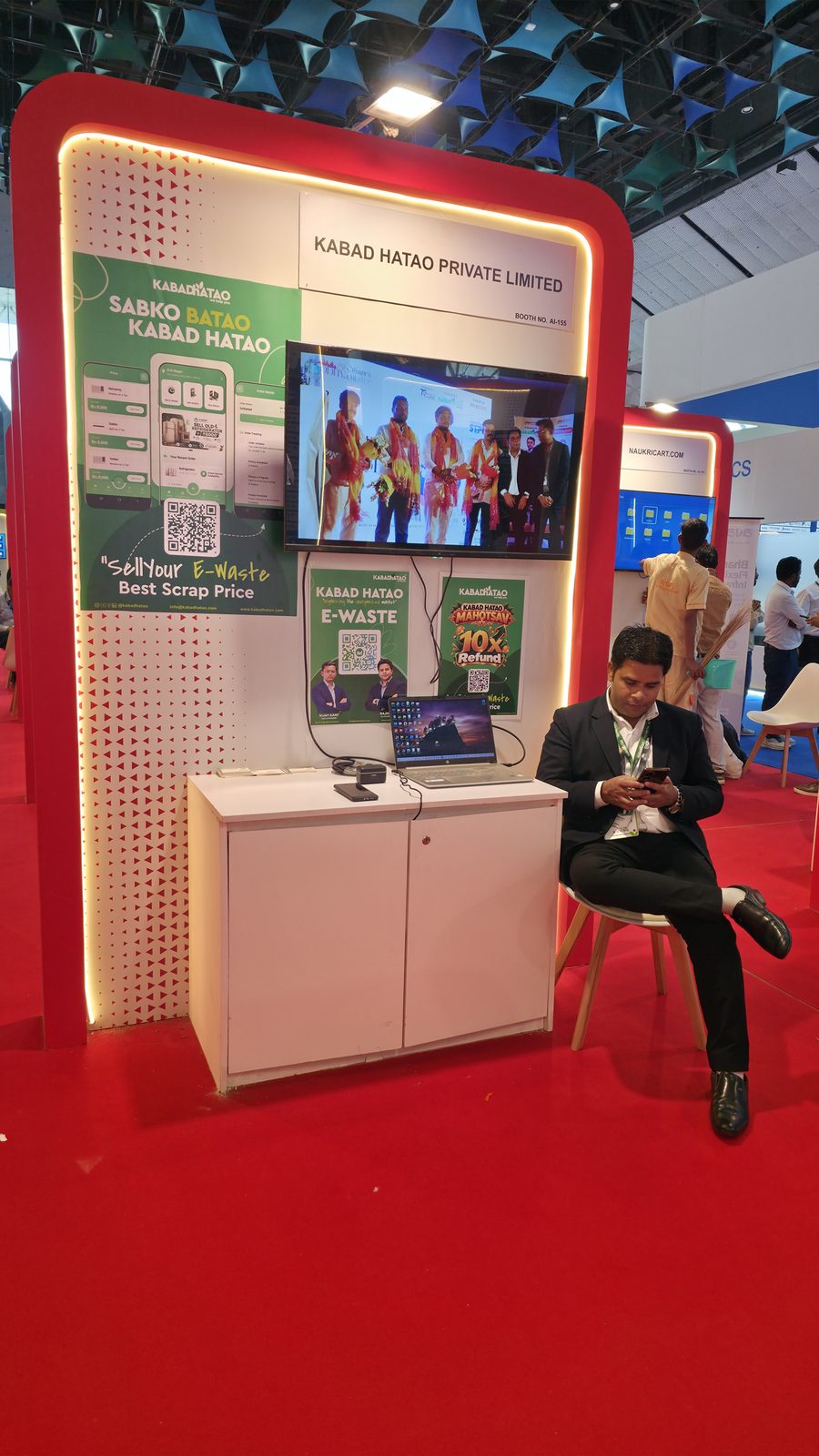 Team member at the Kabad Hatao counter during IMC 2026.