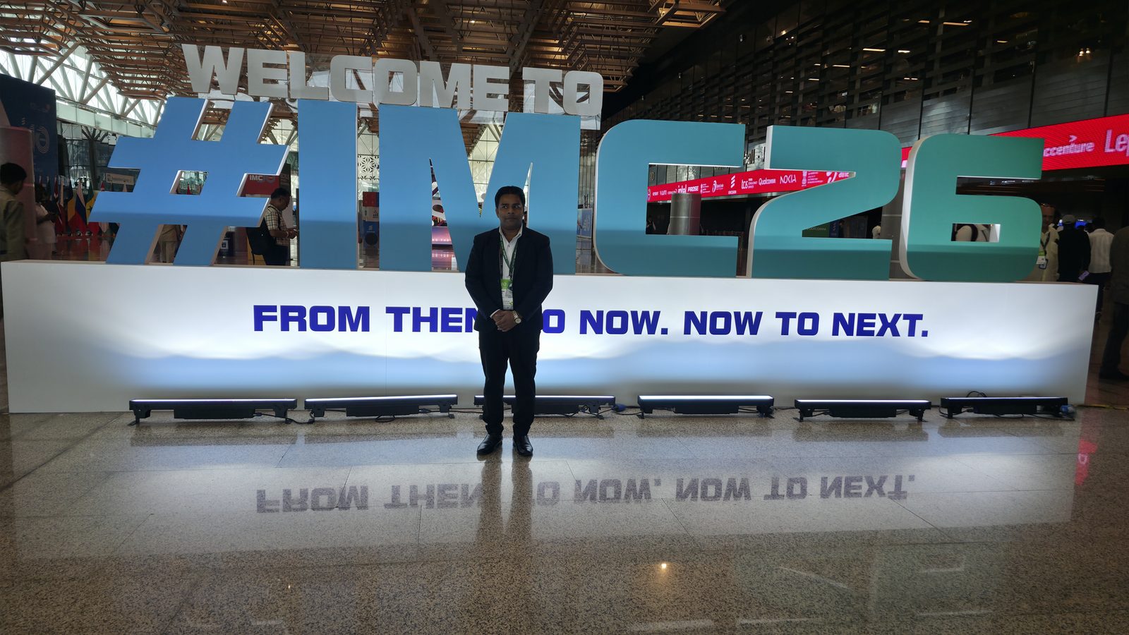 Wide view of the team at the IMC 2026 welcome sign.
