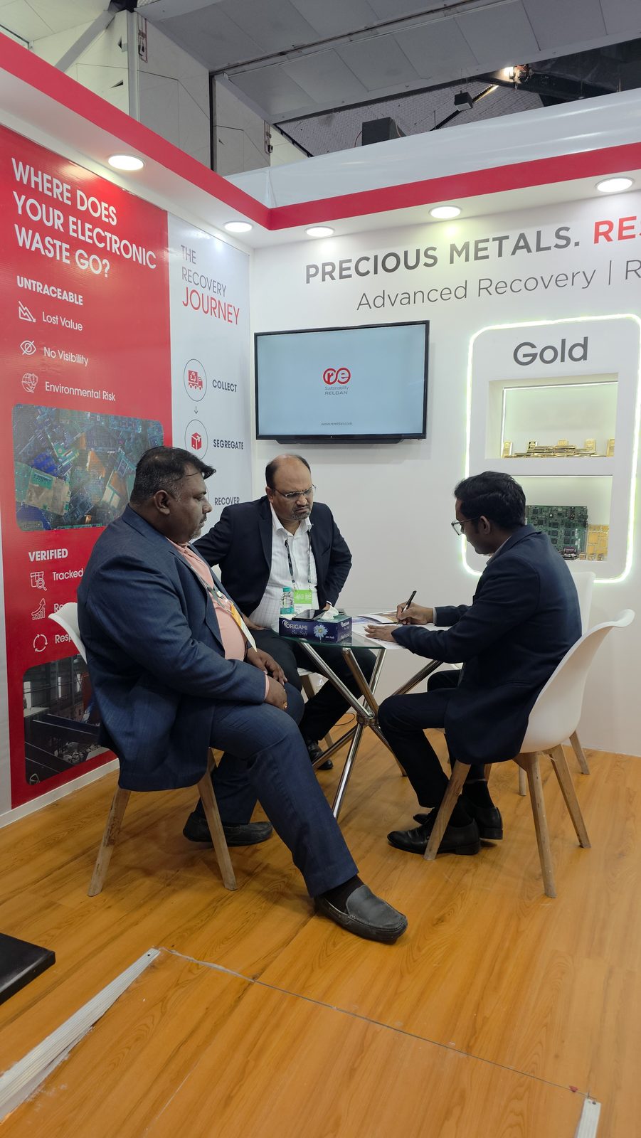 Team in discussion at the e-waste recovery stall.