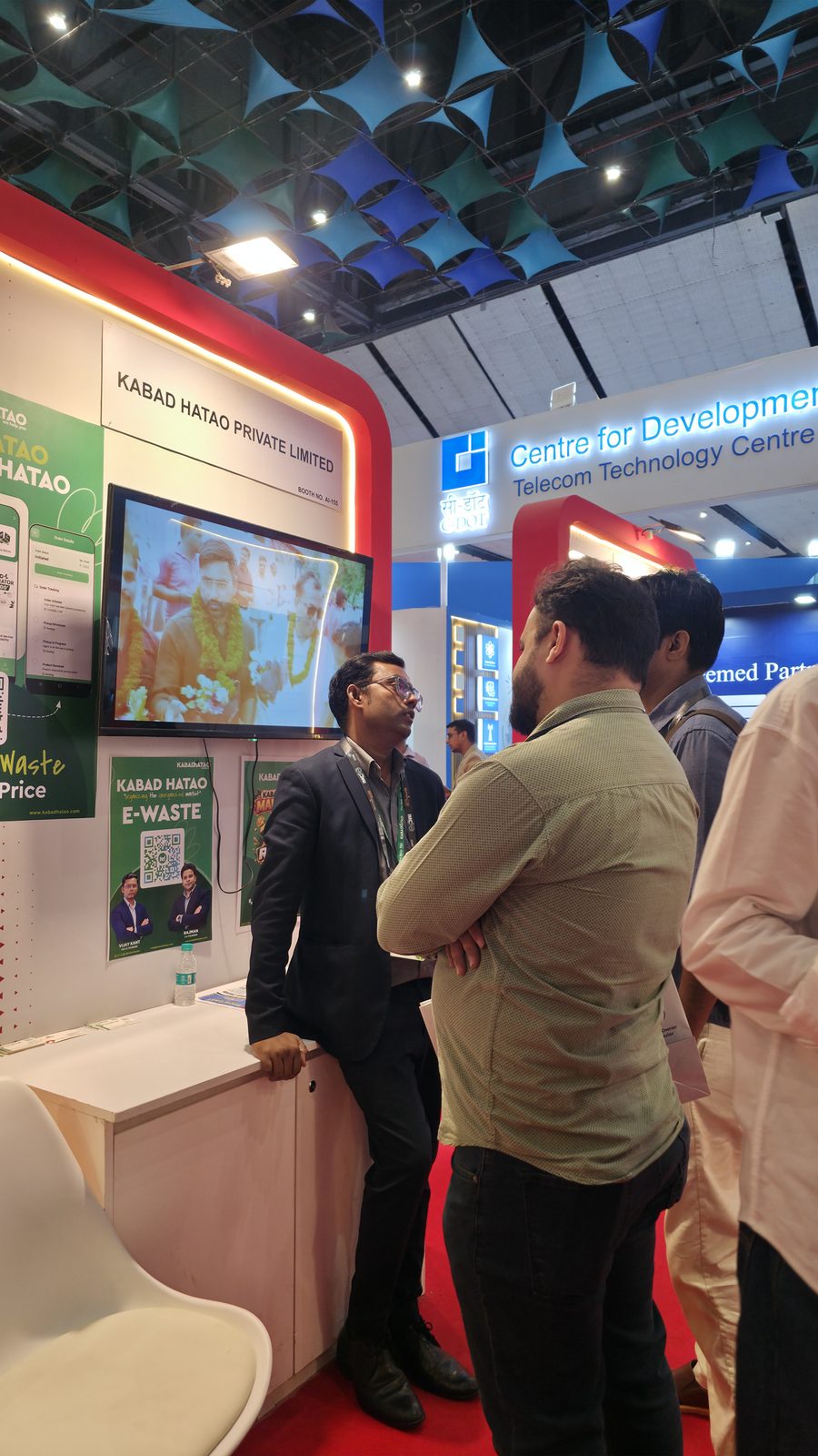 Visitors gathered near booth AI-155.