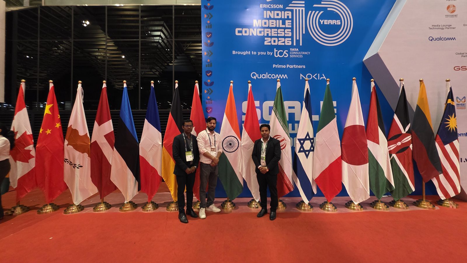 The team beside the IMC 10 Years mark.